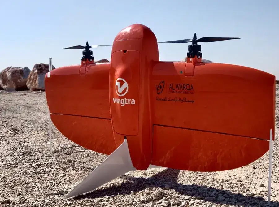 WingtraOne VTOL drone with Al Warqa Survey Engineering branding on desert terrain