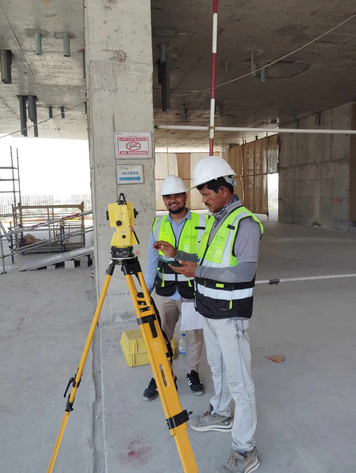 AWSE surveyors tying the scan to control on a bare floor plate